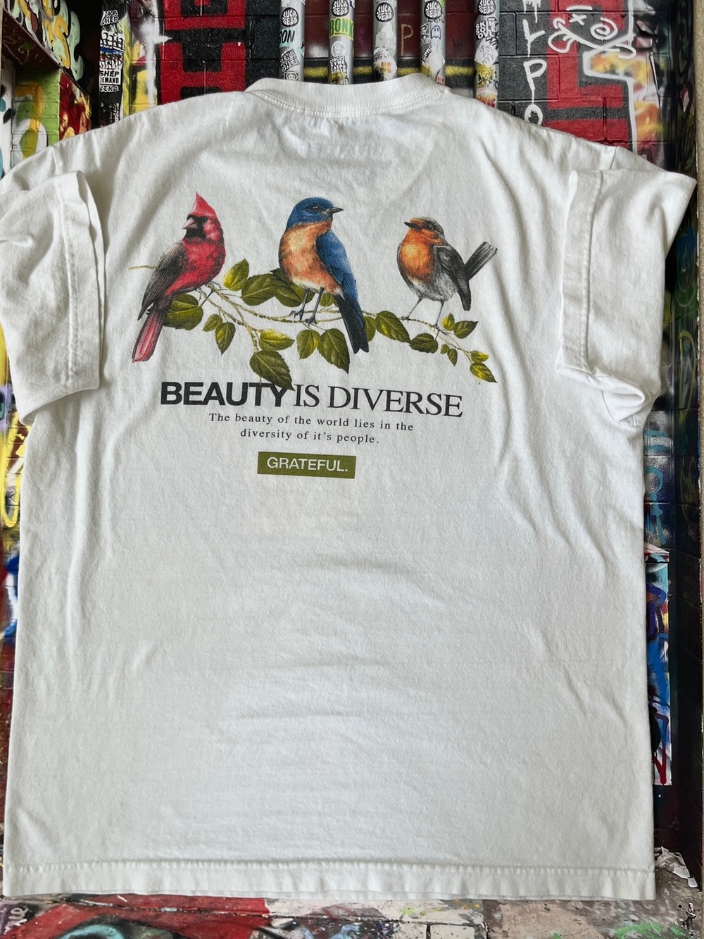 GRATEFUL White "Beauty Is Diverse" Bird Graphic Tee